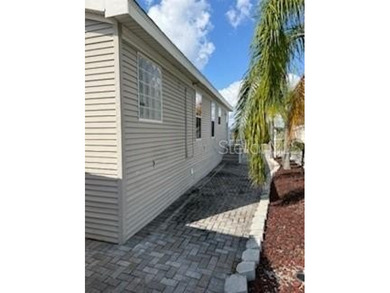 NO LOT RENT!! YOU OWN THE LAND!! Beautifully updated home in the on Southern Dunes Golf and Country Club in Florida - for sale on GolfHomes.com, golf home, golf lot