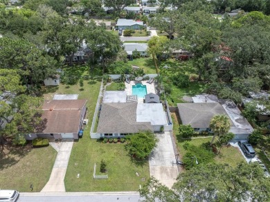 Welcome to your private oasis in the heart of highly on The Dunedin Country Club in Florida - for sale on GolfHomes.com, golf home, golf lot
