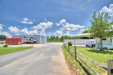 NO LOT RENT!! YOU OWN THE LAND!! Beautifully updated home in the on Southern Dunes Golf and Country Club in Florida - for sale on GolfHomes.com, golf home, golf lot