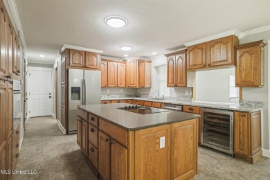 Welcome to your dream home! This beautifully renovated 5-bedroom on Mississippi National Golf Course in Mississippi - for sale on GolfHomes.com, golf home, golf lot