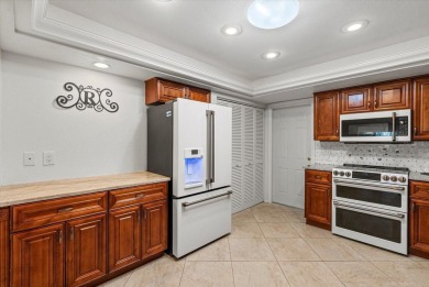 This beautifully renovated villa on a desirable corner lot in on Palm Aire Country Club of Sarasota in Florida - for sale on GolfHomes.com, golf home, golf lot