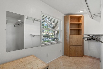 This beautifully renovated villa on a desirable corner lot in on Palm Aire Country Club of Sarasota in Florida - for sale on GolfHomes.com, golf home, golf lot