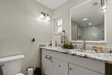This beautifully renovated villa on a desirable corner lot in on Palm Aire Country Club of Sarasota in Florida - for sale on GolfHomes.com, golf home, golf lot