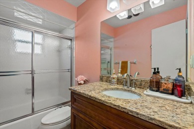 This beautifully renovated villa on a desirable corner lot in on Palm Aire Country Club of Sarasota in Florida - for sale on GolfHomes.com, golf home, golf lot