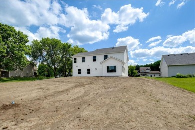 Situated just off of the 16th green of The Vintage Golf Course on Vintage Golf Course in Minnesota - for sale on GolfHomes.com, golf home, golf lot