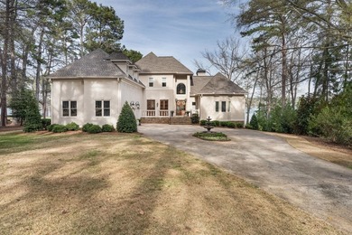 EXTRAORDINARY LAKEFRONT HOME IN GREAT WATERS, WITH EXPANSIVE on Great Waters Course At Reynolds Plantation in Georgia - for sale on GolfHomes.com, golf home, golf lot