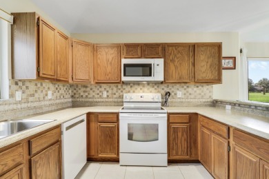 Lovely light and bright 2 bedroom, 2 bath villa with an on Heritage Ridge Golf Club in Florida - for sale on GolfHomes.com, golf home, golf lot