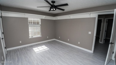 Discover coastal living at its finest in this charming, updated on Holiday Golf Club in Florida - for sale on GolfHomes.com, golf home, golf lot