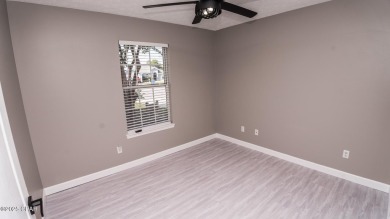Discover coastal living at its finest in this charming, updated on Holiday Golf Club in Florida - for sale on GolfHomes.com, golf home, golf lot
