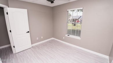 Discover coastal living at its finest in this charming, updated on Holiday Golf Club in Florida - for sale on GolfHomes.com, golf home, golf lot