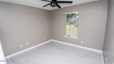 Discover coastal living at its finest in this charming, updated on Holiday Golf Club in Florida - for sale on GolfHomes.com, golf home, golf lot