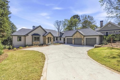 COMPLETELY RENOVATED. REIMAGINED. PRACTICALLY REBUILT FROM THE on Great Waters Course At Reynolds Plantation in Georgia - for sale on GolfHomes.com, golf home, golf lot