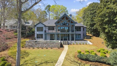 COMPLETELY RENOVATED. REIMAGINED. PRACTICALLY REBUILT FROM THE on Great Waters Course At Reynolds Plantation in Georgia - for sale on GolfHomes.com, golf home, golf lot