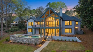 COMPLETELY RENOVATED. REIMAGINED. PRACTICALLY REBUILT FROM THE on Great Waters Course At Reynolds Plantation in Georgia - for sale on GolfHomes.com, golf home, golf lot