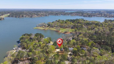 COMPLETELY RENOVATED. REIMAGINED. PRACTICALLY REBUILT FROM THE on Great Waters Course At Reynolds Plantation in Georgia - for sale on GolfHomes.com, golf home, golf lot