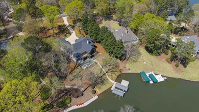 COMPLETELY RENOVATED. REIMAGINED. PRACTICALLY REBUILT FROM THE on Great Waters Course At Reynolds Plantation in Georgia - for sale on GolfHomes.com, golf home, golf lot