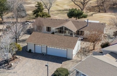 Designed for both comfort and style, this home is truly a gem on Quail Wood Greens Golf Course in Arizona - for sale on GolfHomes.com, golf home, golf lot