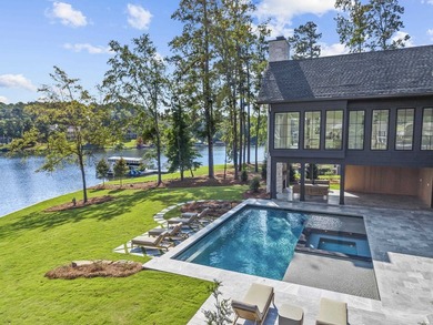MODERN CALIFORNIA-INSPIRED LAKEFRONT RETREAT WITH POOL | Built on Harbor Club Golf and Country Club in Georgia - for sale on GolfHomes.com, golf home, golf lot