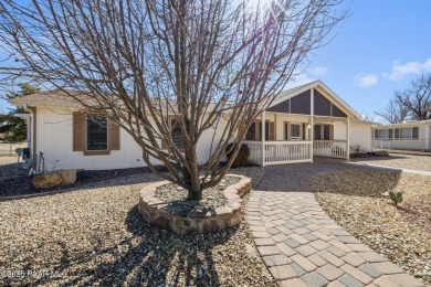 Designed for both comfort and style, this home is truly a gem on Quail Wood Greens Golf Course in Arizona - for sale on GolfHomes.com, golf home, golf lot