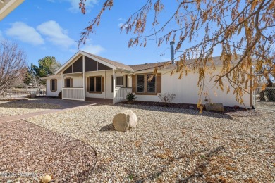 Designed for both comfort and style, this home is truly a gem on Quail Wood Greens Golf Course in Arizona - for sale on GolfHomes.com, golf home, golf lot