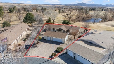 Designed for both comfort and style, this home is truly a gem on Quail Wood Greens Golf Course in Arizona - for sale on GolfHomes.com, golf home, golf lot