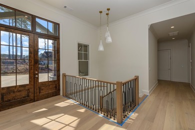 Experience refined living in this newly built custom home on Reynolds Lake Oconee - The Oconee in Georgia - for sale on GolfHomes.com, golf home, golf lot