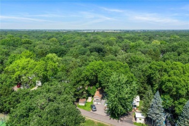 Experience seasonal living at its finest in the gated commnunity on Travelers Country Club in Minnesota - for sale on GolfHomes.com, golf home, golf lot