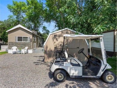 Experience seasonal living at its finest in the gated commnunity on Travelers Country Club in Minnesota - for sale on GolfHomes.com, golf home, golf lot
