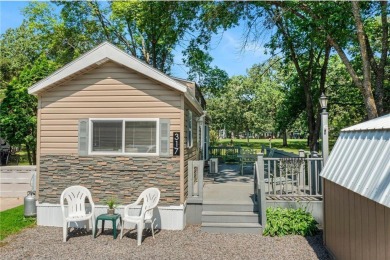 Experience seasonal living at its finest in the gated commnunity on Travelers Country Club in Minnesota - for sale on GolfHomes.com, golf home, golf lot