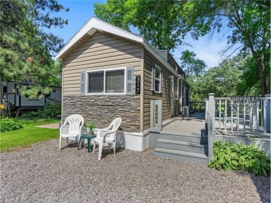 Experience seasonal living at its finest in the gated commnunity on Travelers Country Club in Minnesota - for sale on GolfHomes.com, golf home, golf lot