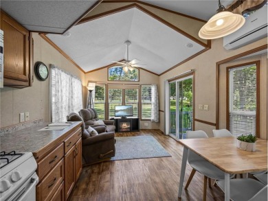 Experience seasonal living at its finest in the gated commnunity on Travelers Country Club in Minnesota - for sale on GolfHomes.com, golf home, golf lot