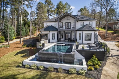 Welcome to this stunning lakefront home in the gated community on The Golf Club at Cuscowilla in Georgia - for sale on GolfHomes.com, golf home, golf lot