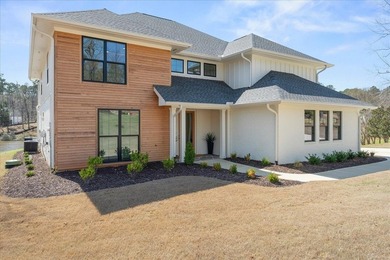 Discover this stunning new construction perched directly on on Harbor Club Golf and Country Club in Georgia - for sale on GolfHomes.com, golf home, golf lot