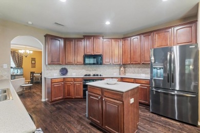 Enjoy your morning coffee on the covered patio while taking in on Ridgeview Ranch Golf Club in Texas - for sale on GolfHomes.com, golf home, golf lot