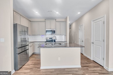 This beautifully maintained 3-bedroom, 2.5-bath townhome in the on Browns Mill Golf Course in Georgia - for sale on GolfHomes.com, golf home, golf lot