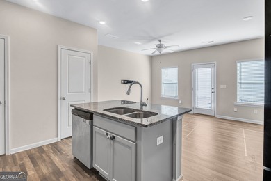 This beautifully maintained 3-bedroom, 2.5-bath townhome in the on Browns Mill Golf Course in Georgia - for sale on GolfHomes.com, golf home, golf lot