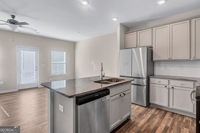 This beautifully maintained 3-bedroom, 2.5-bath townhome in the on Browns Mill Golf Course in Georgia - for sale on GolfHomes.com, golf home, golf lot