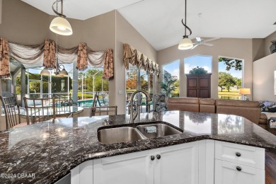 IMPECCABLE WATERFRONT POOL HOME!! Welcome to your on Plantation Bay Golf and Country Club in Florida - for sale on GolfHomes.com, golf home, golf lot