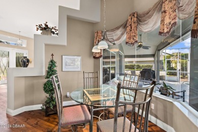 IMPECCABLE WATERFRONT POOL HOME!! Welcome to your on Plantation Bay Golf and Country Club in Florida - for sale on GolfHomes.com, golf home, golf lot