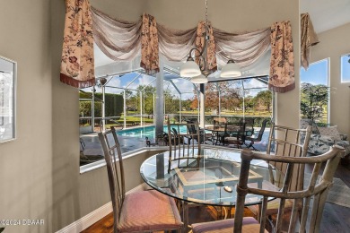 IMPECCABLE WATERFRONT POOL HOME!! Welcome to your on Plantation Bay Golf and Country Club in Florida - for sale on GolfHomes.com, golf home, golf lot