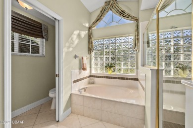 IMPECCABLE WATERFRONT POOL HOME!! Welcome to your on Plantation Bay Golf and Country Club in Florida - for sale on GolfHomes.com, golf home, golf lot