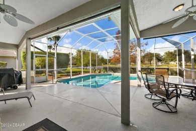 IMPECCABLE WATERFRONT POOL HOME!! Welcome to your on Plantation Bay Golf and Country Club in Florida - for sale on GolfHomes.com, golf home, golf lot