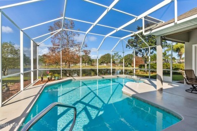 IMPECCABLE WATERFRONT POOL HOME!! Welcome to your on Plantation Bay Golf and Country Club in Florida - for sale on GolfHomes.com, golf home, golf lot