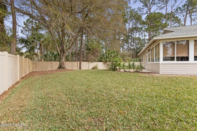 Welcome to your ideal home on Treetop Trail in the exclusive on Plantation Bay Golf and Country Club in Florida - for sale on GolfHomes.com, golf home, golf lot