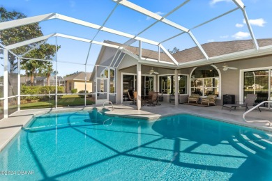 IMPECCABLE WATERFRONT POOL HOME!! Welcome to your on Plantation Bay Golf and Country Club in Florida - for sale on GolfHomes.com, golf home, golf lot