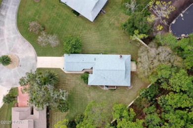 Welcome to your ideal home on Treetop Trail in the exclusive on Plantation Bay Golf and Country Club in Florida - for sale on GolfHomes.com, golf home, golf lot