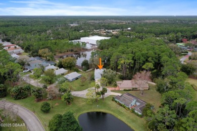 Welcome to your ideal home on Treetop Trail in the exclusive on Plantation Bay Golf and Country Club in Florida - for sale on GolfHomes.com, golf home, golf lot