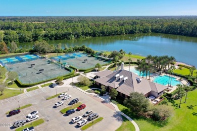 Welcome to your ideal home on Treetop Trail in the exclusive on Plantation Bay Golf and Country Club in Florida - for sale on GolfHomes.com, golf home, golf lot