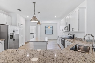 Experience the beauty of living on a golf course in this on Valencia Golf and Country Club in Florida - for sale on GolfHomes.com, golf home, golf lot