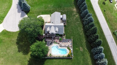 Wake up to sweeping fairway views and end your day poolside at on Briar Leaf Golf Club in Indiana - for sale on GolfHomes.com, golf home, golf lot
